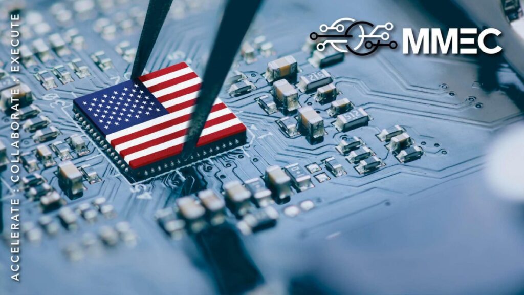Close-up of a microchip on a circuit board with a small U.S. flag, alongside MMEC branding and the slogan Accelerate, Collaborate, Execute (vertical text].